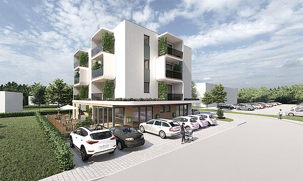 Ein Haus. Das Haus hat vier Etagen und viele Balkone. Vor dem Haus stehen Autos. Neben dem Haus ist Wiese.