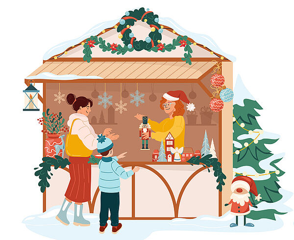Eine Bude von einem Weihnachtsmarkt. Eine Frau steht in der Bude. Sie verkauft Figuren. Eine Frau und ein Kind stehen vor der Bude. 