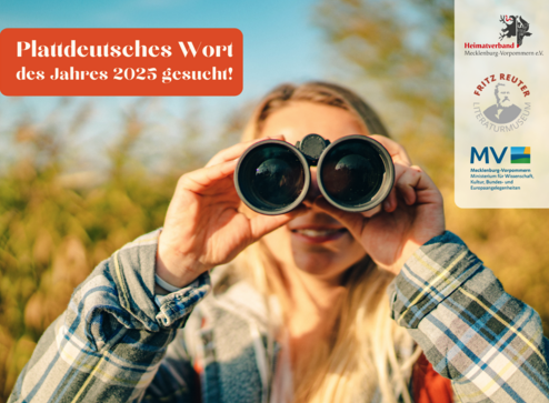 Eine Frau schaut durch ein Fernglas. 